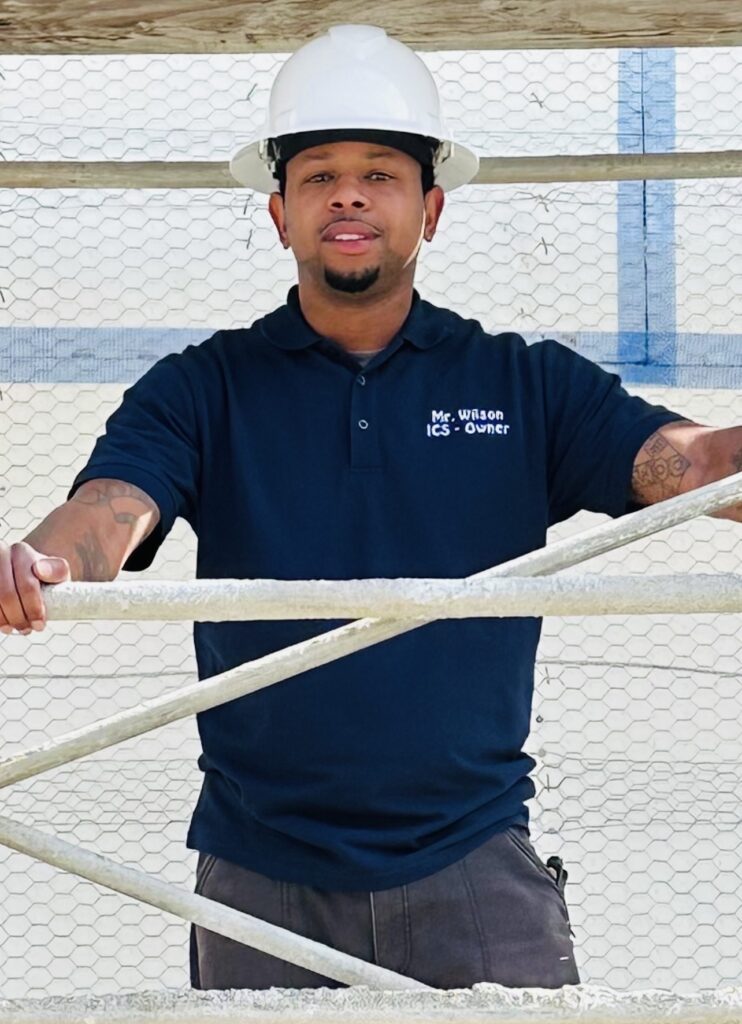 Man in hard hat on construction site.